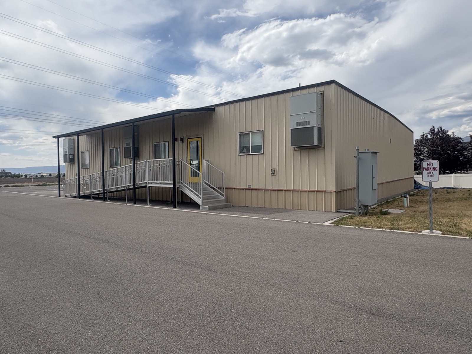 The portable modular building at the Springville campus, with open farmland visible beyond